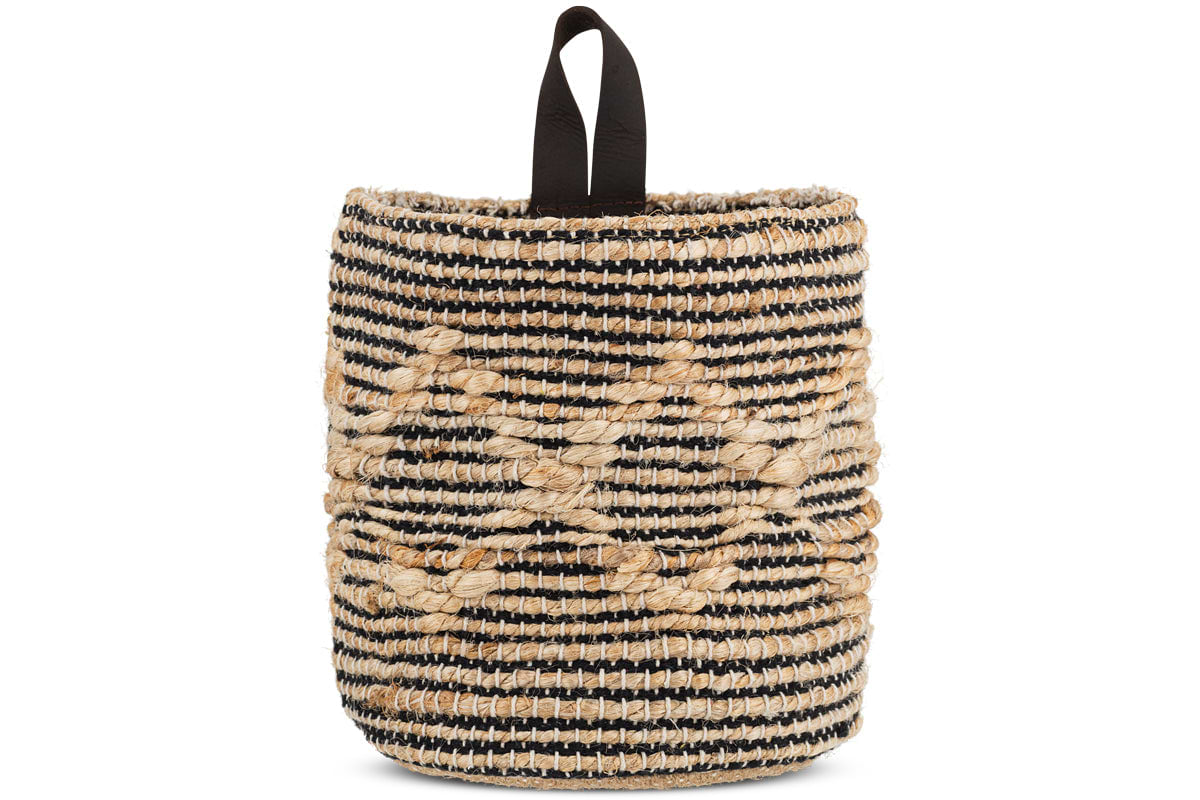 The nkuku Mannu Cotton & Hemp Wall Hung Basket in natural and black features coarse, handwoven horizontal stripes, a loop handle for easy wall hanging, and raised diamond patterns crafted from thick beige fibers. Perfect as handmade storage.