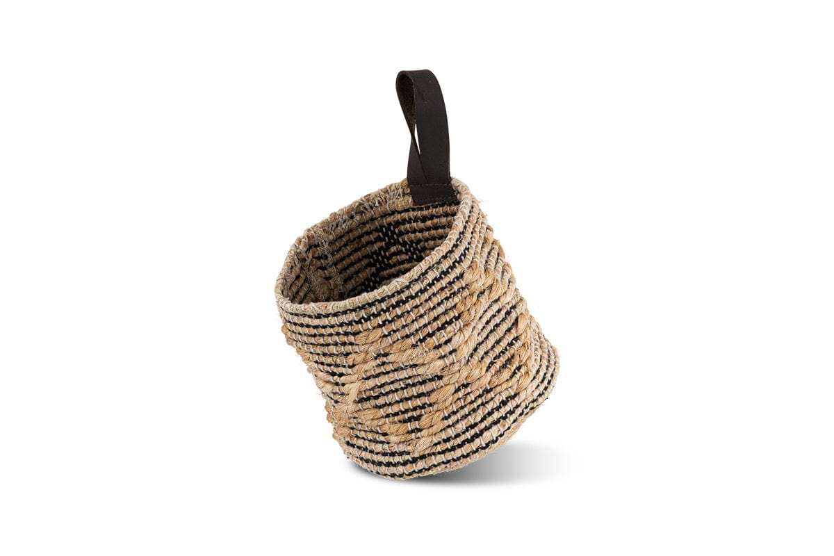 The Mannu Cotton & Hemp Wall Hung Basket by nkuku features a small, round shape in natural beige and black, with a looped fabric handle for hanging and a textured spiral weave—perfect as a stylish cotton and hemp storage basket.