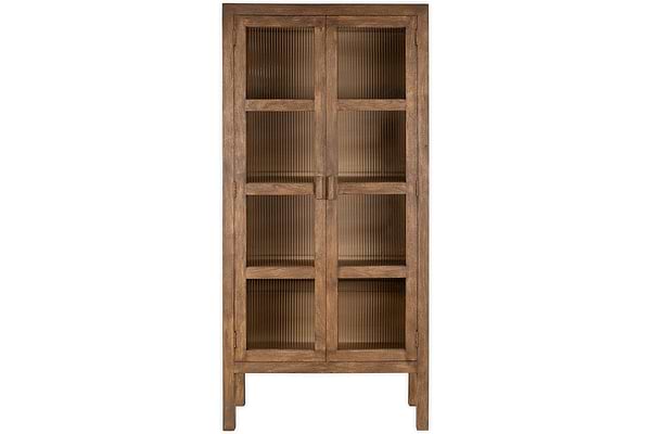 The Mendani Mango Wood & Fluted Glass Cabinet by nkuku features a tall, freestanding design in a walnut stain with two vertically grooved glass doors, simple rectangular lines, four short legs, and multiple shelves visible through the fluted panels.