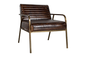 The Mirai Ribbed Leather Armchair by nkuku features a vintage-inspired design with handmade dark brown buffalo leather cushions, slim bronze-finished metal armrests and legs, and a minimalist industrial aesthetic against a plain white background.