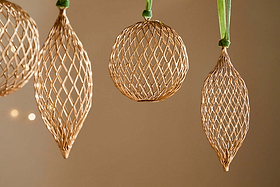 The nkuku Nirav Wire Baubles – Brass (Set of 4) are perfect for adding elegance to your Christmas décor.