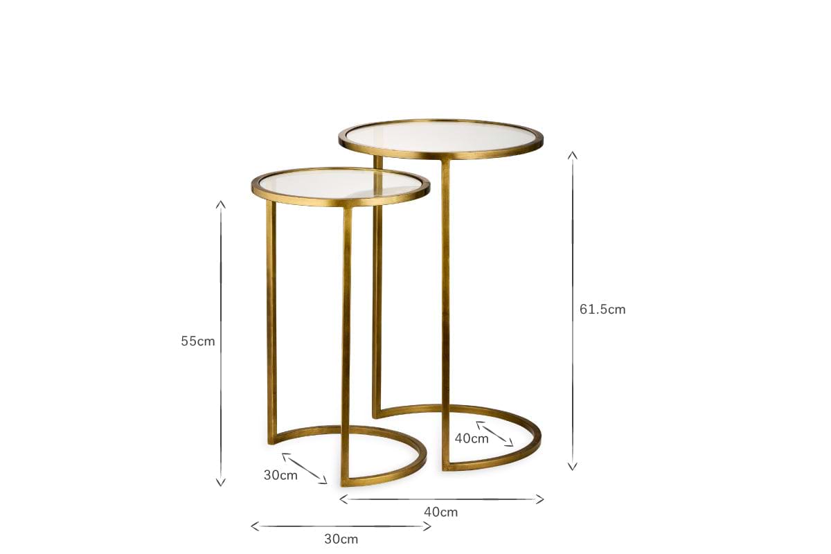 The nkuku Nakuru Iron & Glass Side Table Set - Brass includes two round nesting tables with glass tops and gold iron frames. Heights: 61.5cm and 55cm; base widths: 40cm and 30cm. Elegant and space-saving for any room.