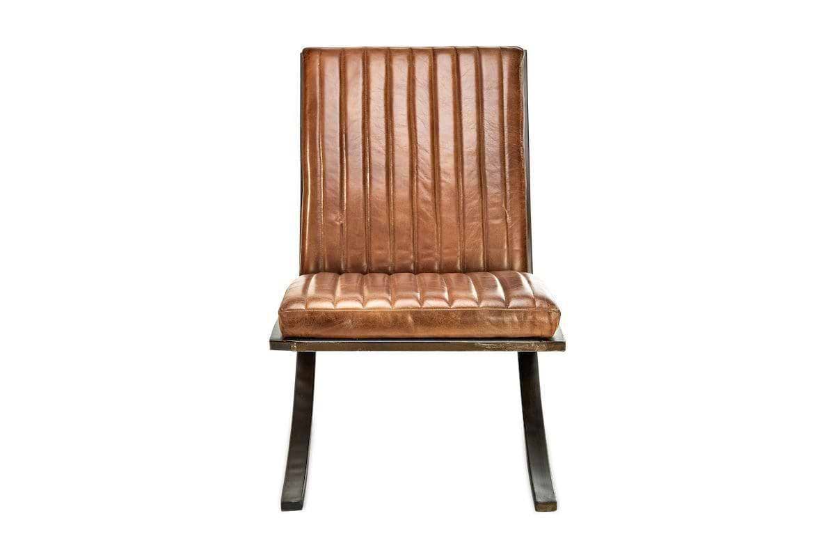 Front view of the nkuku Narwana Ribbed Leather Lounger in aged tan, featuring ribbed stitching and channel tufting on the padded seat and back, supported by a sturdy dark metal frame.