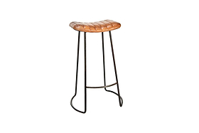 The Narwana Ribbed Leather Stool - Aged Tan (Large) by nkuku features a modern ribbed leather saddle seat, slender black metal legs with footrest, and subtly curved base supports, shown against a plain white background.
