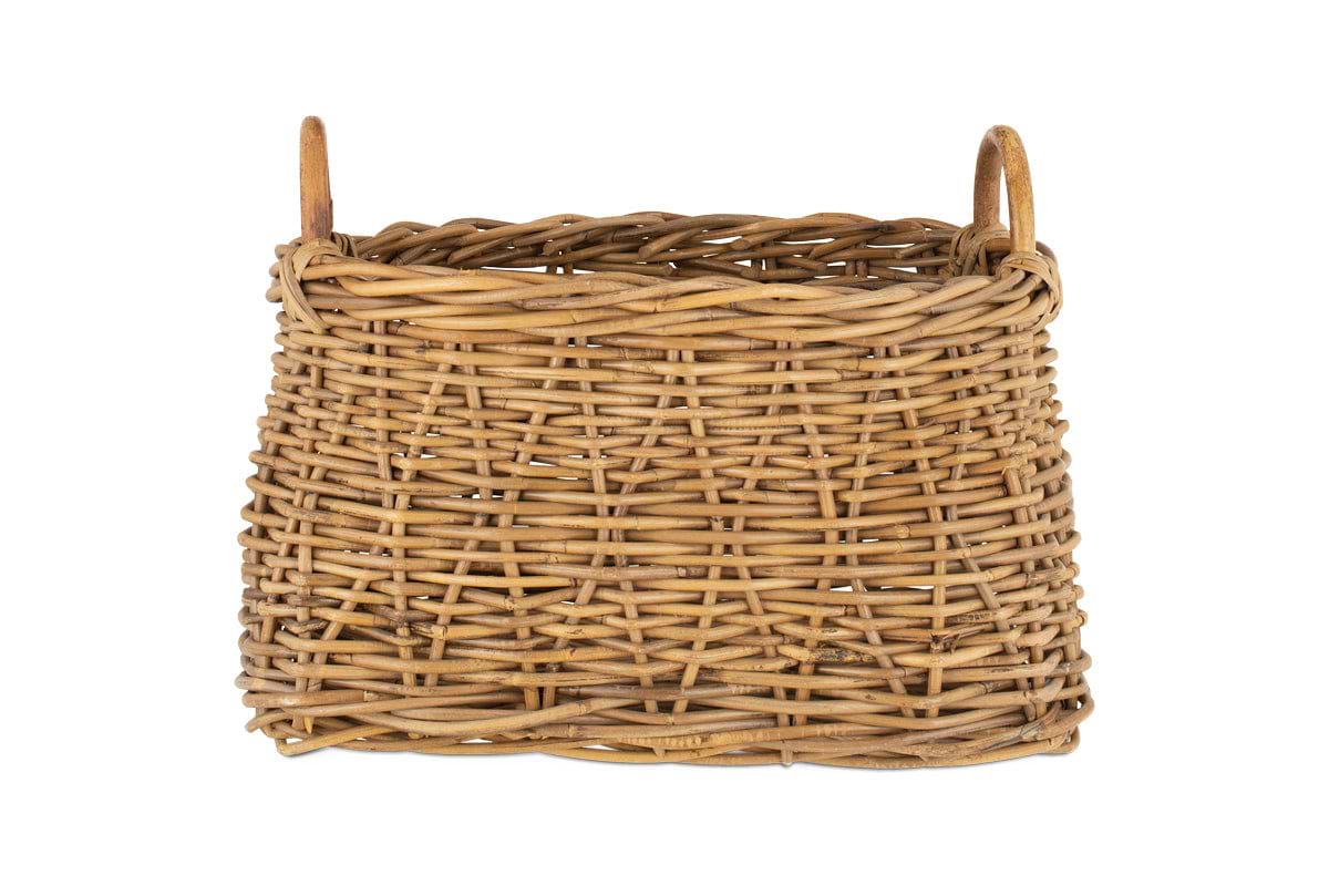 The Netra Rattan Basket by nkuku is a rectangular, natural-toned basket with a woven pattern, two rounded side handles, and an open top—ideal for decorative storage and showcased here against a plain white background.