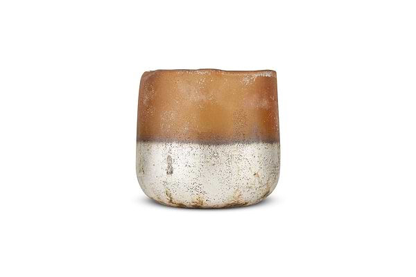 The Ngolo Tealight Holder - Antiqued Amber by nkuku is a small, round ceramic pot with a matte brown top and textured metallic silver base. It features an uneven, wavy rim and rustic, handmade appeal on a plain white background.