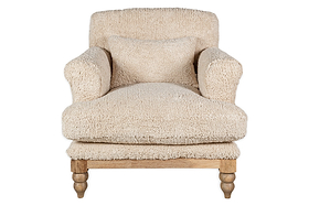 The nkuku Otas Teddy Cotton Armchair in off white features plush, textured fabric, thick rounded arms, a matching cushion, and four turned natural mango wood legs. The background is plain white.