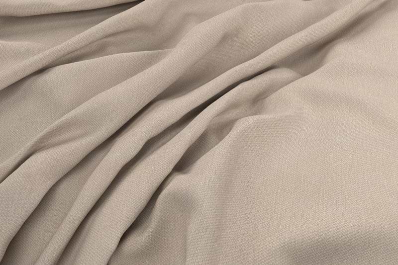 Close-up of nkuku's Recycled Cotton Natural Swatch, showcasing light beige fabric with a subtle woven texture, soft natural folds, gentle draping, and smooth yet slightly textured surface with shadowed valleys and raised ridges.