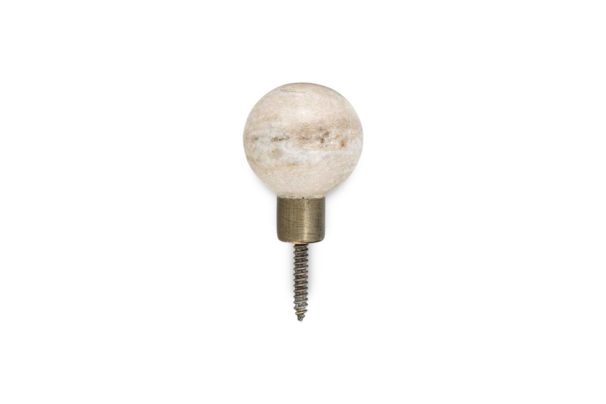 The nkuku Paladi Marble & Iron Round Hook - Grey showcases a round marble knob with a brass-finished iron base and visible screw, offering hand-carved style and elegant simplicity against a white background.