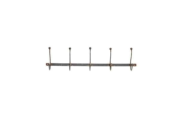 The nkuku Rama Iron Hook is a rustic, horizontal metal wall rack featuring five evenly spaced, upward-curving iron hooks. Visible screws secure each hook to the backplate, making it ideal for hallway storage and organization.