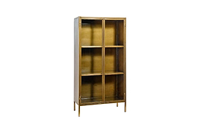 The Ranchi Iron Tall Cabinet by nkuku features a modern metallic gold finish, four shelves, two glass-fronted doors, and slender legs. Photographed against a plain white background.