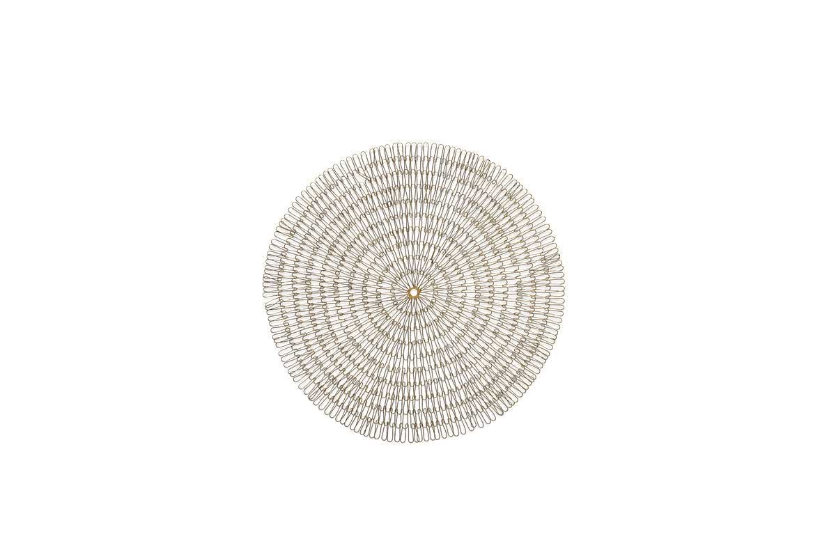The nkuku Rayan Wire Wall Art in Antique Brass features an intricate radial pattern with concentric circles, adding artisan charm and textured elegance to any wall decor. Its handcrafted design stands out beautifully against a plain white background.