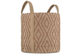 The Renu Jute Basket by nkuku is cylindrical with two handles, featuring a rust and natural geometric kilim design, vertical tan straps, and a coarse natural fiber texture.