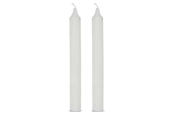 The nkuku Rustic Soy Blend Dinner Candles in white come as a set of 2. Each tall, smooth candle features a pointed tip and short, unlit wick, standing upright side by side against a plain white background.