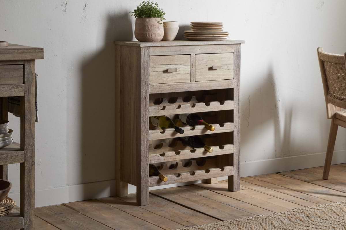 The Shanthi Reclaimed Wood Wine Rack by nkuku offers stylish wine bottle storage and space for bottles and plates, making it a perfect rustic addition to your home.