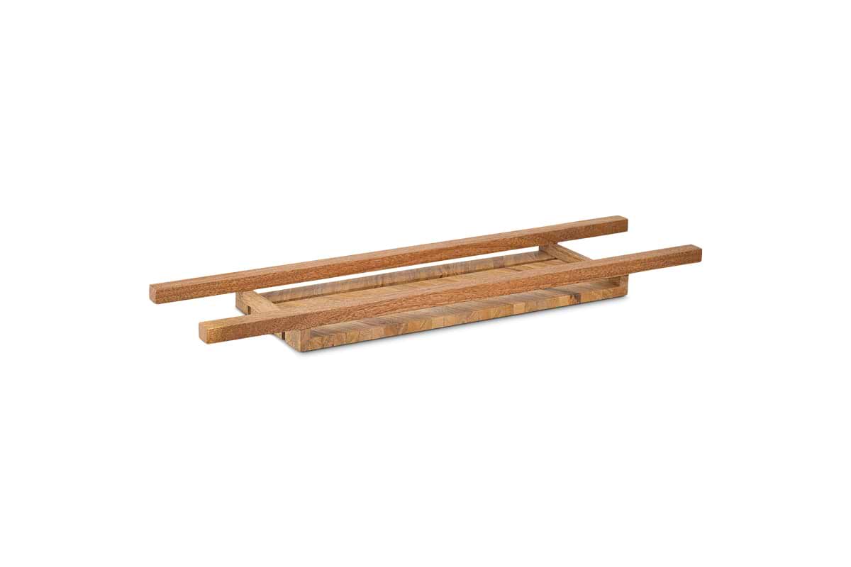 The Sukha Mango Bath Bridge - Natural by nkuku features a rectangular mango wood tray with raised sides and parallel handles. Its natural finish and minimalist design create a spa-like ambiance in your bathroom.
