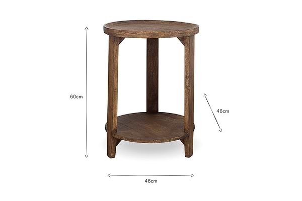 The Triveni Mango Wood Side Table by nkuku features a round design with three legs and a lower shelf. Finished in walnut stain, it measures 60cm in height and 46cm wide, with clean lines. Measurement lines appear on a plain white background.