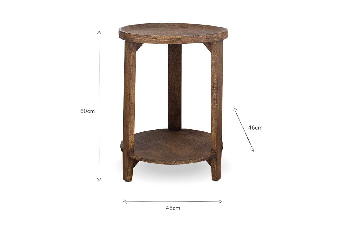 The Triveni Mango Wood Side Table by nkuku features a round design with three legs and a lower shelf. Finished in walnut stain, it measures 60cm in height and 46cm wide, with clean lines. Measurement lines appear on a plain white background.