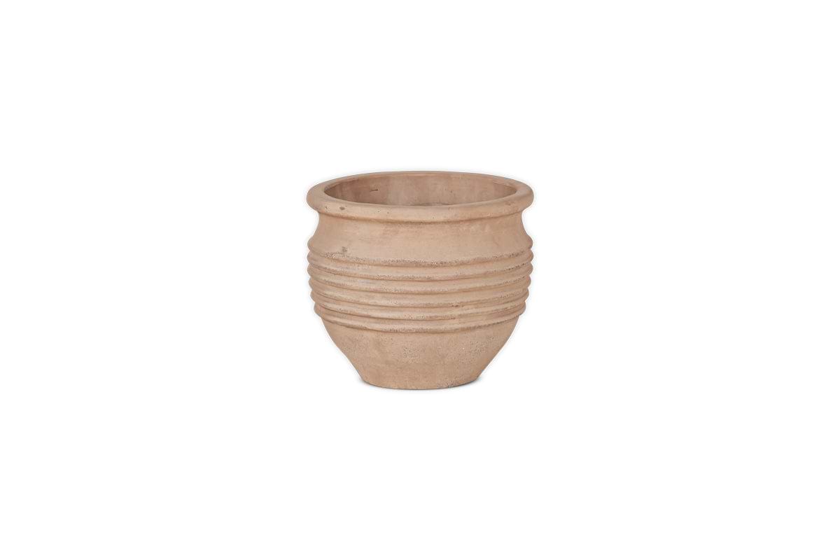 The nkuku Ullu Terracotta Planter is a round, unglazed beige planter with horizontal ridges and a matte, textured finish. Its wide opening makes it ideal for indoor or outdoor use, shown centered on a plain white background.