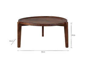 The Umar Mango Wood Coffee Table by nkuku features a sculptural round design with three legs, a curved edge, and a dark brown finish. Measuring 94cm wide by 46cm tall, it stands out beautifully against a plain white background.