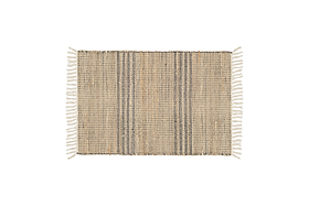 The Varli Jute & Cotton Doormat by nkuku features a handcrafted rectangular design with beige and dark brown vertical stripes, white fringes on the short edges, and is ideal as an indoor entryway mat. Background is plain white.