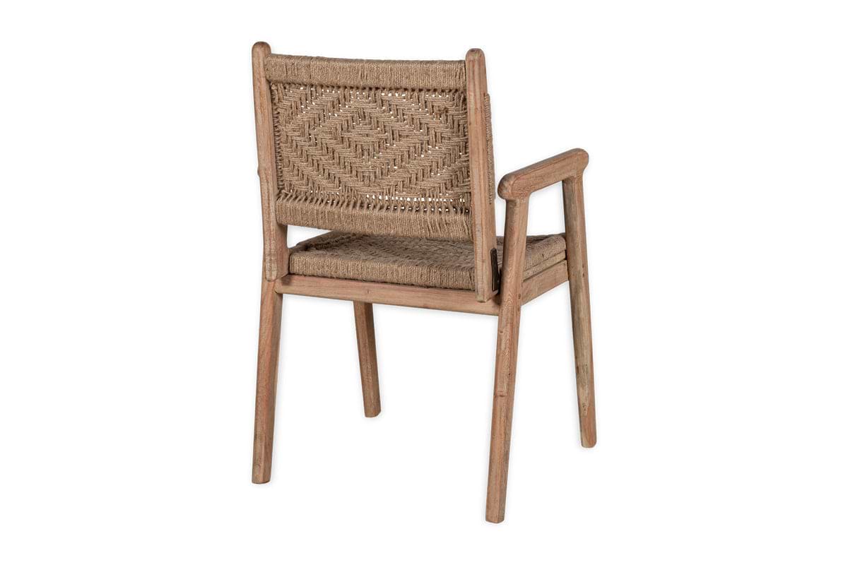 The Vinay Woven Dining Chair - Natural by nkuku features an acacia wood frame, woven rattan seat and backrest with a diamond pattern, simple armrests, and straight legs, shown at an angle against a plain white background.