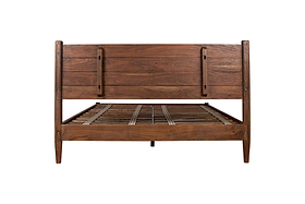 The nkuku Anbu Acacia Bed in Washed Walnut features a sculptural frame with a slatted headboard, tapered legs, and a natural wood grain finish, shown from the front without a mattress.