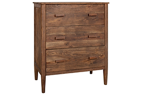 The nkuku Anbu Acacia Chest of Drawers in Washed Walnut features three drawers with simple handles, tapered legs, and a natural wood grain—a timeless storage solution perfect for any bedroom.