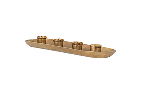 The nkuku Amita Long Candle Holder in antique brass features a textured, brushed oval tray with five evenly spaced cylindrical holders, creating an elegant and minimalist centrepiece for your dining table.