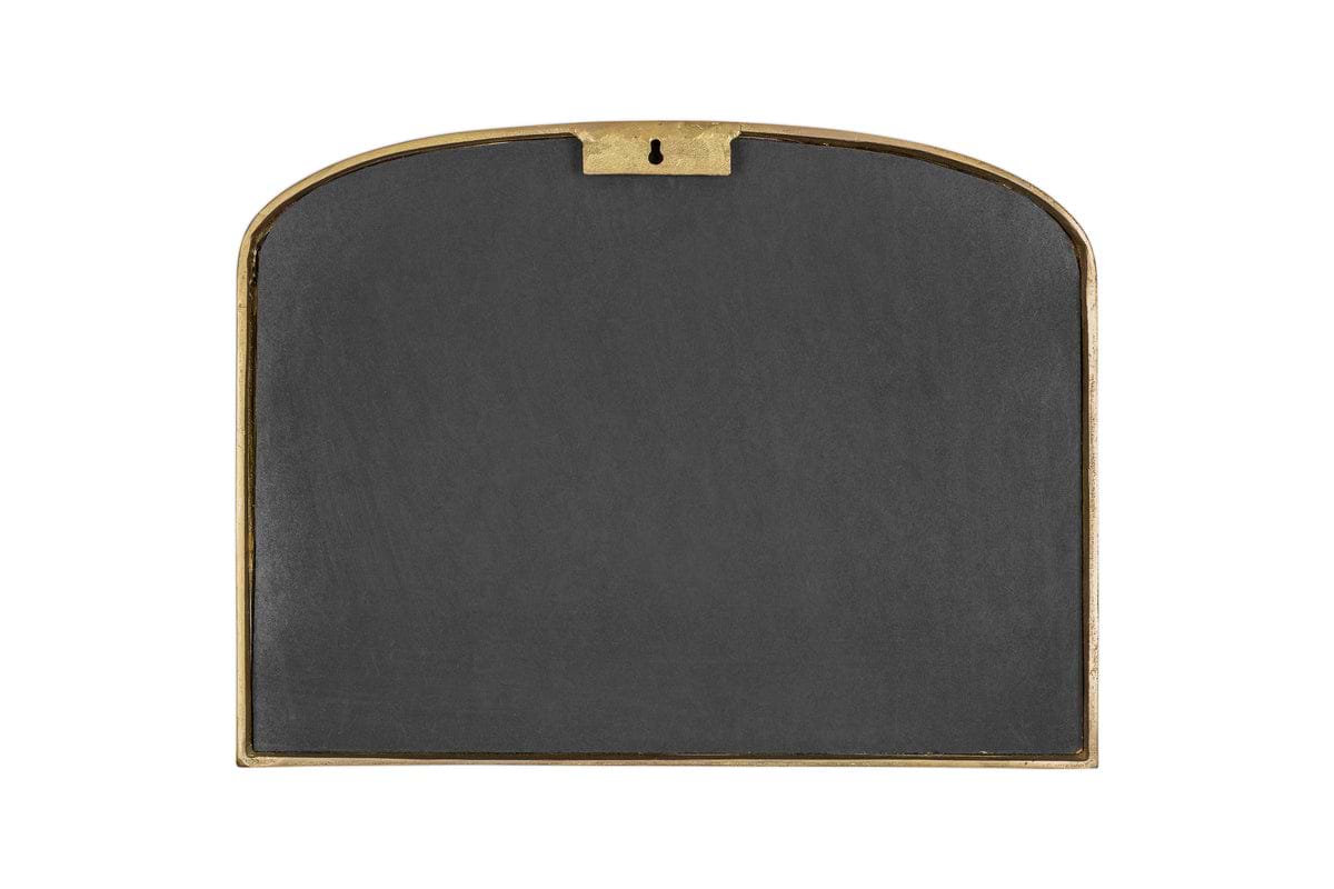 The Almora Wall Mirror by nkuku is an extra small, arch-topped mirror with an antique brass frame and a hanging hook at the top center, reminiscent of a classic arched design.