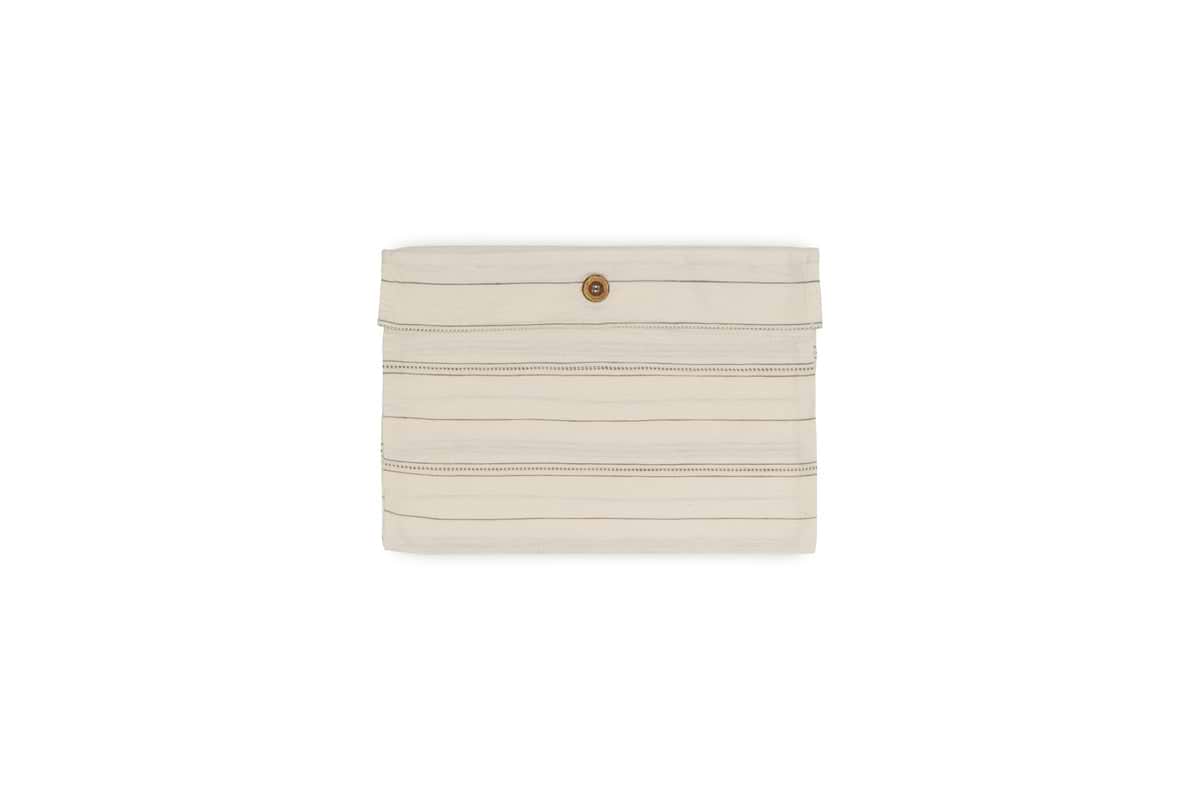 The nkuku Anta Hemp & Cotton Housewife Pillowcase in sage green features a brown button closure and is showcased centered on a white background.