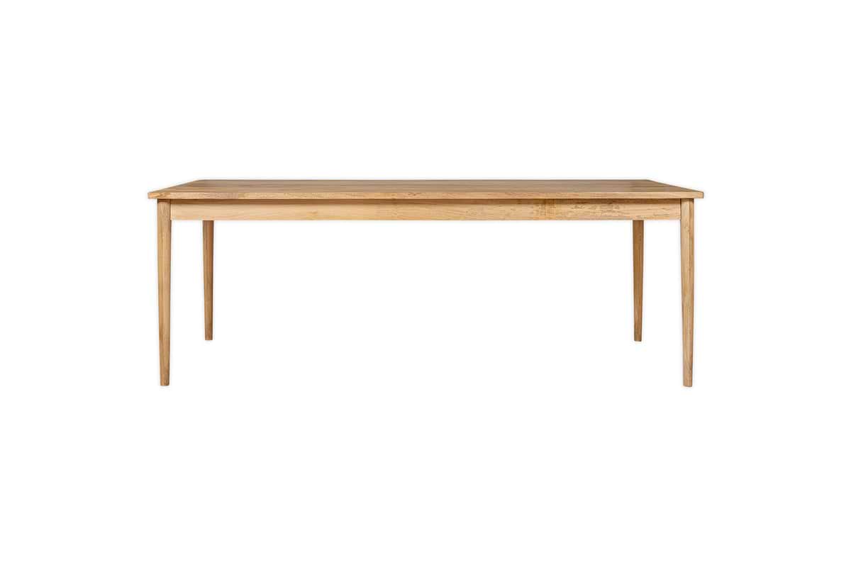 The nkuku Anbu Mango Dining Table - Natural is a rectangular mango wood table with four straight legs and a light natural finish, shown against a plain white background.