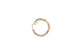 The nkuku Cerita Bracelet - Rhodochrosite showcases round marbled pink and beige stones, strung together with a gold chain extender and clasp. Presented on a plain white background, it’s a versatile accessory.