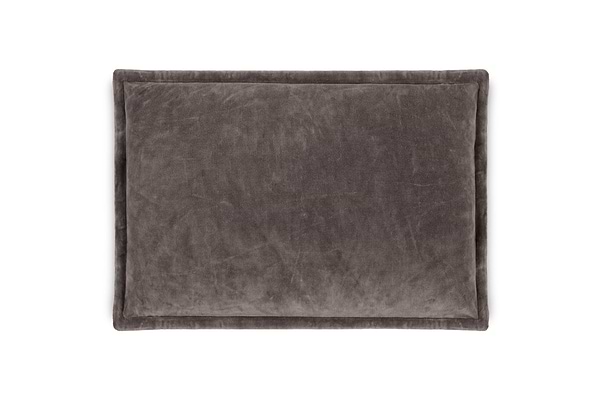The nkuku Dhara Velvet Cushion Cover in charcoal is a rectangular, dark gray decorative cover with a soft, plush texture and slightly raised edges, offering stylish comfort for any space. Shown here against a white background.