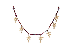 The Didi Star Garland - Antique Brass by nkuku features seven handcrafted brass stars with gold charms on a dark red cord, combining rustic and celestial details for a festive, Christmas-inspired look.