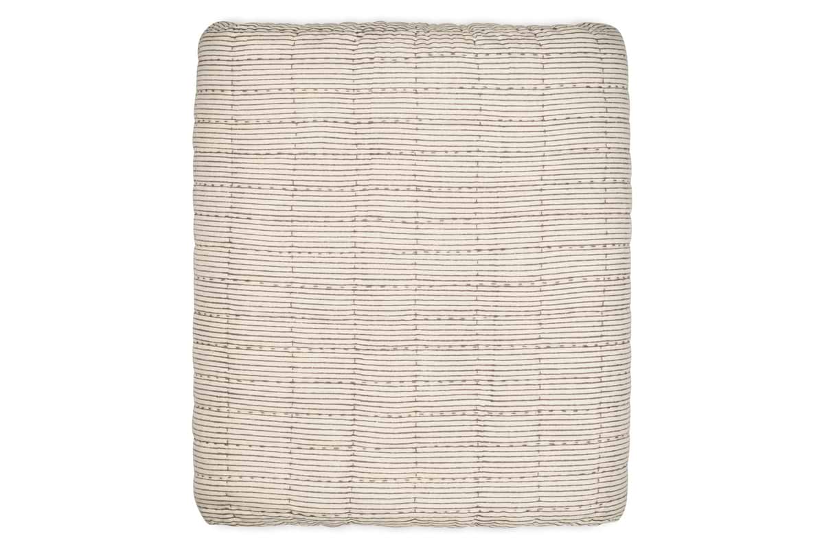 The nkuku Dipti Cotton & Linen Block Print Bed Quilt in Charcoal features a minimalist grid pattern, blending soft, textured cotton and linen. Perfect as a King size quilt for a modern bedroom.