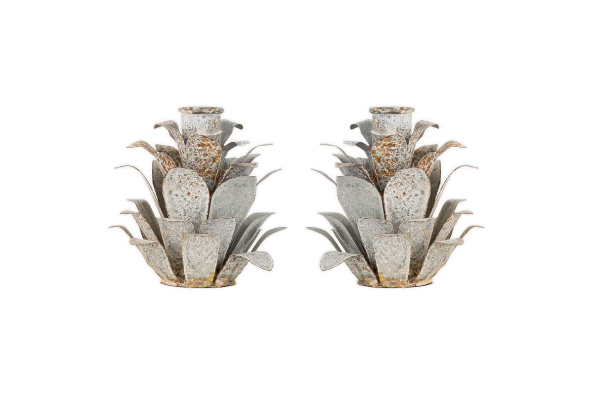 The nkuku Elagalu Pine Cone Candle Holders (Set of 2) are crafted from zinc with layered, spiky details and a rustic finish—stylish festive accents or unique Christmas candleholders for your tabletop.