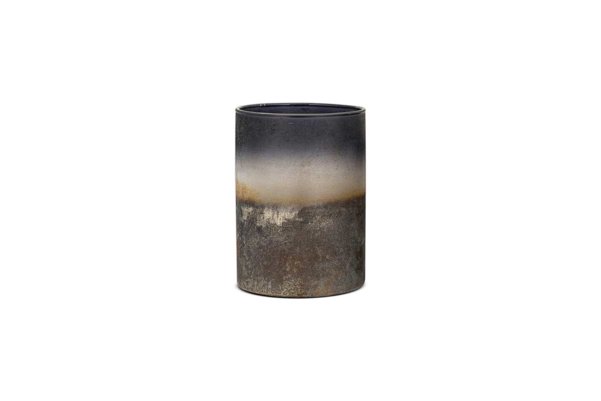 The Etti Tealight Holders in Navy & Smoke by nkuku feature a rustic cylindrical ceramic design with a dark-to-light gradient, perfect for adding an ambient glow to any room.