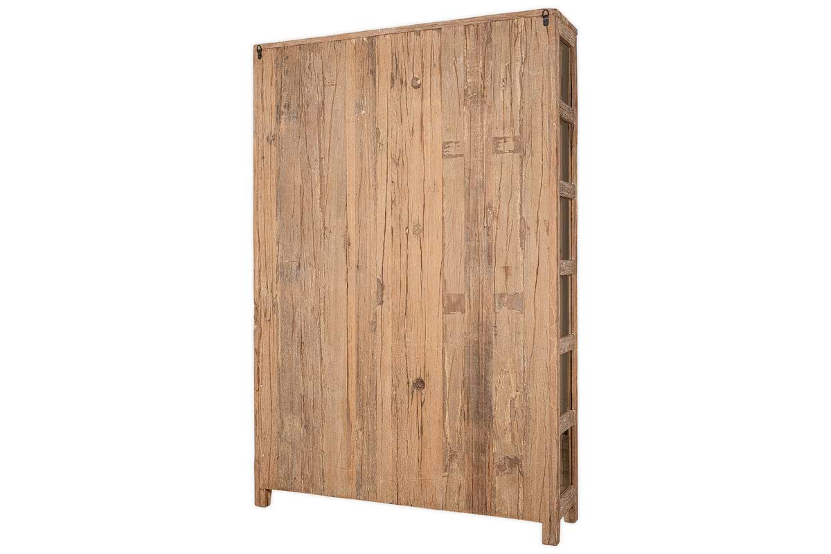 The nkuku Ibo Reclaimed Wood & Glass Cabinet - Natural - Wide is a tall, rectangular piece with a simple, sturdy design, featuring natural wood texture and glass panels. Seen from the front and side, it has a rustic look with no visible ornamentation.