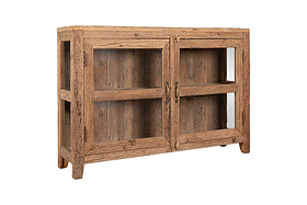 The Ibo Reclaimed Wood & Glass Sideboard by nkuku features two glass-paneled doors with antique brass handles, two interior shelves, a natural weathered finish, and stands on four short legs.