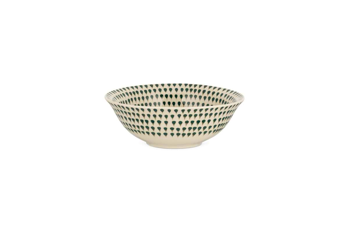 The nkuku Juniper Drop Dinnerware Set - Cream & Juniper (Set of 12) showcases cream ceramic pieces adorned with evenly spaced juniper green drop designs, displayed elegantly on a white background.