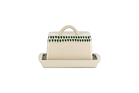 The nkuku Juniper Drop Butter Dish - Cream & Juniper is a rectangular ceramic dish with a handled lid and green drop detailing along the top edge, all set on a white background.