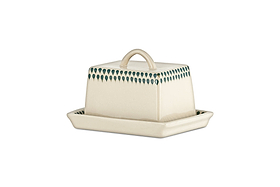 The nkuku Juniper Drop Butter Dish - Cream & Juniper features a rectangular ceramic design with a cream lid edged in green drops and a curved handle, offering both charm and elegance to your table.