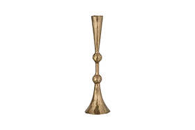 The Javanee Candle Holder by nkuku features a tall, slender silhouette in antique brass with a hammered texture, sculptural elegance, two rounded bulges on its stem, and a flared base. Shown upright against a white background.