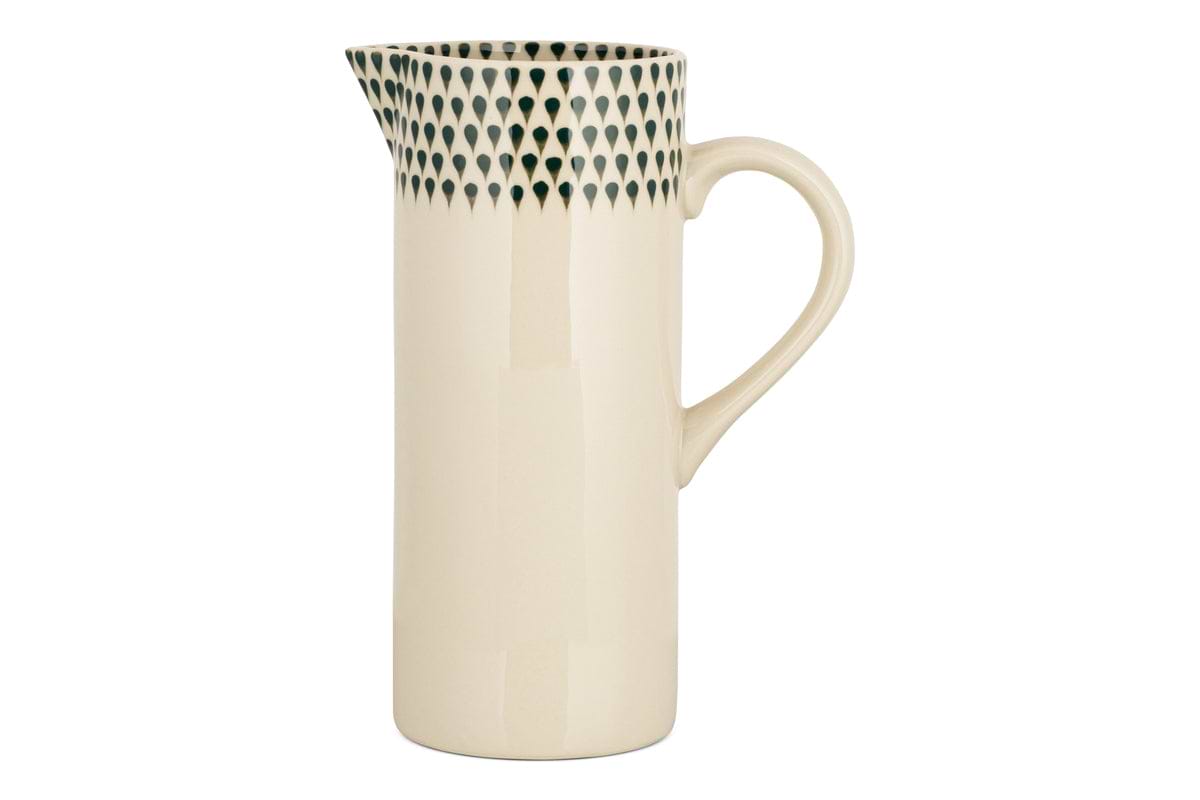 The nkuku Juniper Drop Jug - Cream & Juniper - Large features a tall, cream design with a curved handle and dark green teardrop accents—ideal as a water jug or decorative vase.