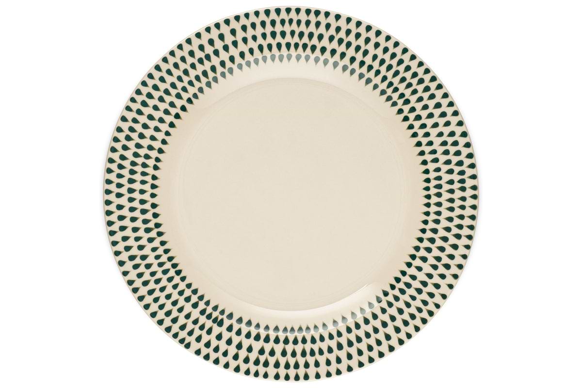The Juniper Drop Dinner Plate by nkuku features a cream ceramic design with a decorative green drop pattern around the rim, shown from above on a white background.