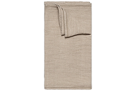 The Junto Linen Runner- Natural - Large by nkuku is displayed on a white background. Its smooth, beige linen finish and crisp edges add elegance and harmony to any table setting.