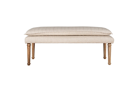 The Kiana Cotton Upholstered Bench by nkuku features a cushioned seat and wooden legs in a natural finish—an elegant accent piece for any room, shown against a white background.