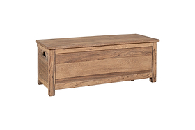 The Karadi Reclaimed Wood Storage Bench - Natural by nkuku features a hinged lid, cut-out side handles, and a natural wood grain finish. This rustic bench sits on short legs and is shown against a white background.