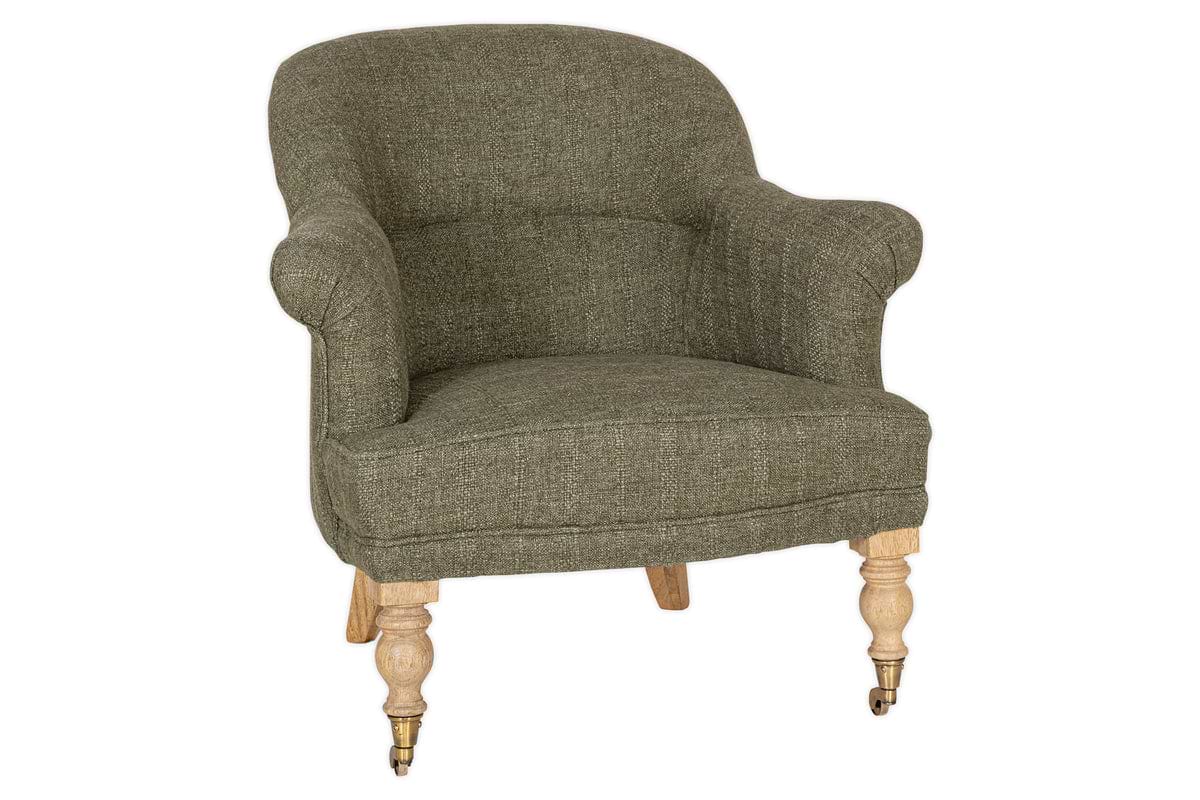 The Kiana Cotton Armchair - Moss by nkuku features green cotton upholstery, curved armrests, a cushioned seat, and wooden legs—hand-carved mango wood with brass caster wheels at the front and straight back legs.